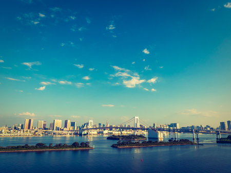 Beautiful cityscape with architecture building and rainbow bridge in tokyo city japan on blue sky and white cloudの写真素材
