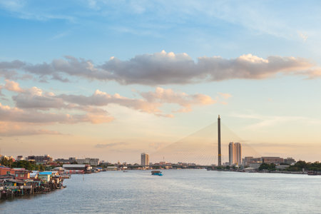 river is home to skyscrapers and bridges over the river in the evening.