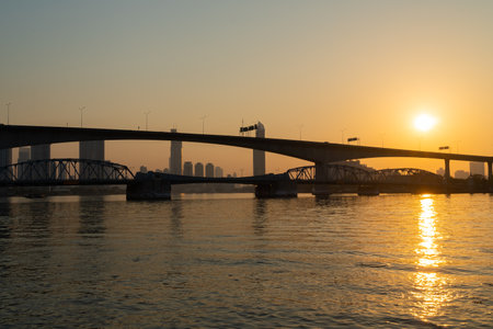 Dawn with the bridge in the morning. In the city of Bangkok on the river in the morningの写真素材