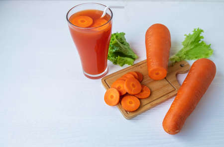 Healthy fresh carrot juice on the white tableの写真素材