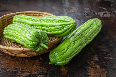 Fresh bitter gourd in a basketの写真素材