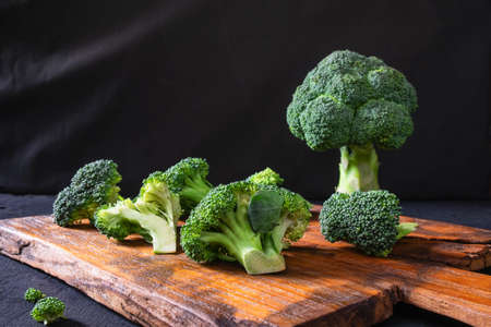Fresh Broccoli on a Wooden Chopping Boardの写真素材