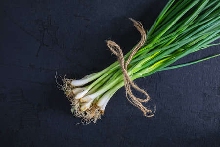 .Fresh onion on black backgroundの写真素材
