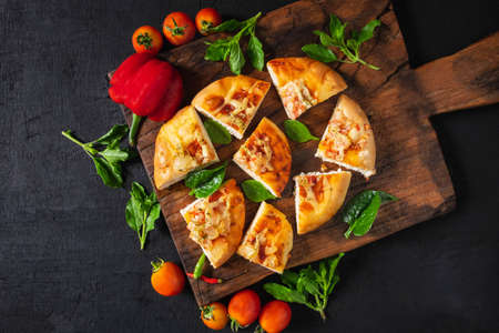 .Hot pizza on wooden tray for pizzaの写真素材
