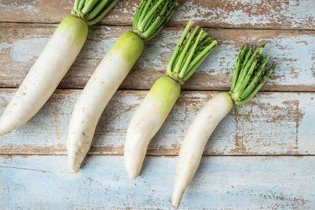 .Radish on a wooden background