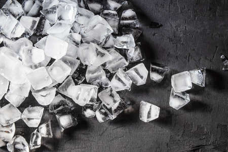 Ice cubes on a black backgroundの写真素材
