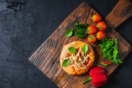 pizza on wooden pizza boardの写真素材