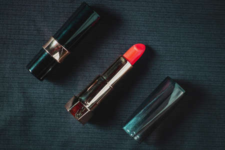 Lipstick sticks on a black background