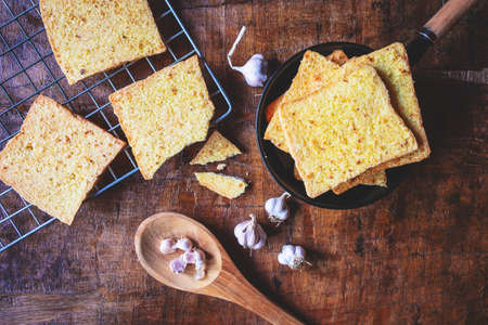 Cook fresh garlic bread from the oven