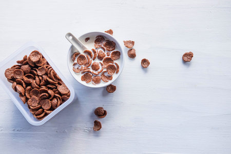 .Breakfast cereal with fresh milk on the white table