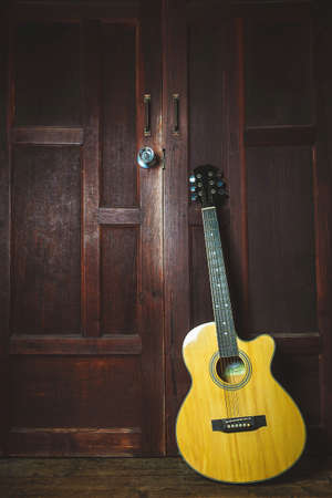 Classical guitar on old wooden backgroundの写真素材