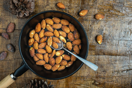 Healthy almonds in a bowl on a wooden tableの写真素材