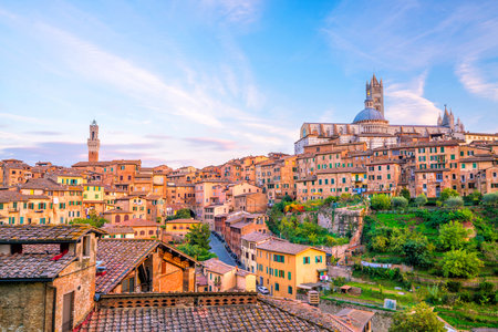 Downtown Siena skyline in Italy with blue skyの写真素材