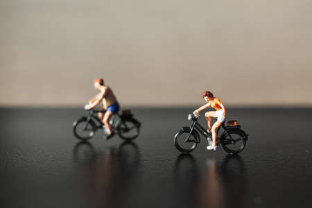 Miniature people : Travelers riding bicycleの写真素材
