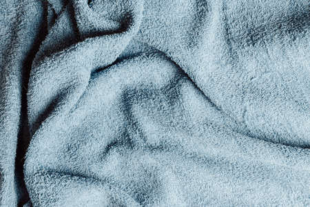 Top view from the top of a light blue towel with some hard wrinklesの写真素材