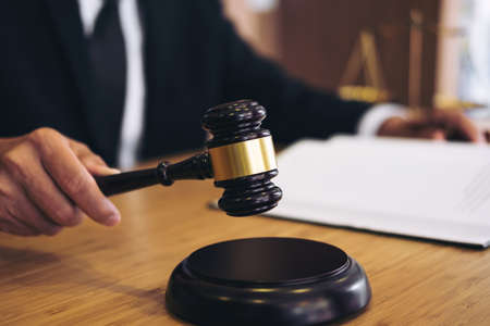 Judge gavel with Justice lawyers, Businessman in suit or lawyer working on a documents. Legal law,...