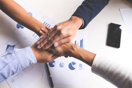 Image of business, Concept of Teamwork people joining hands.