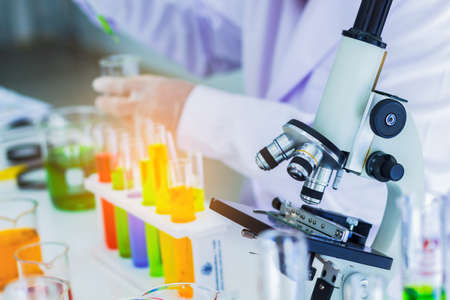 Close-up, medical laboratory, scientists use a microscope for testing liquid biology. technology