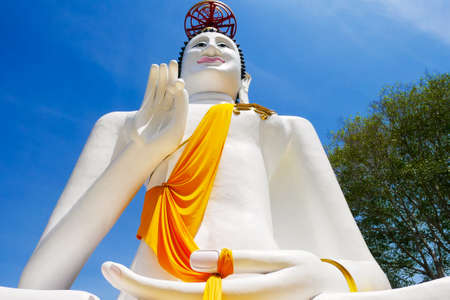 Large white buddha statue on blue sky background Beliefs and beliefs of Buddhismの写真素材