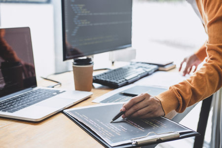Young Professional programmer working at developing programming and website working in a software...