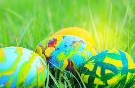 Beautiful easter eggs multicolored on the grass