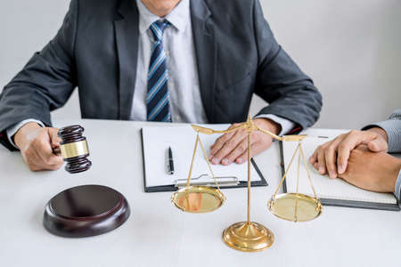 Male lawyer or Counselor working in courtroom have meeting with client are consultation with...