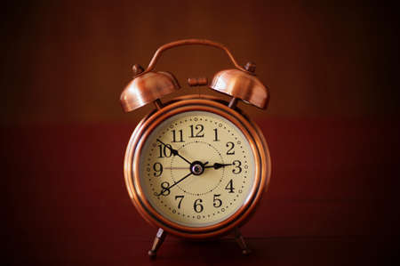 alarm clock on wood tableの写真素材