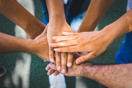 Businessman and working person coordinate hands. Concept Teamwork in business