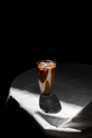 glass of iced coffee with milk on the table