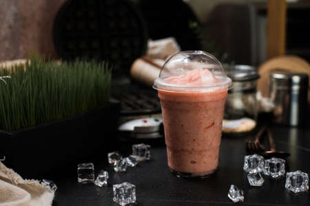 berry smoothie served on black table at cafeâ€‹
