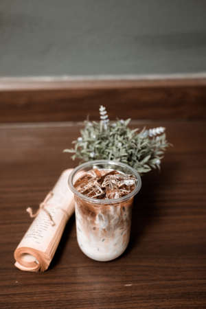 glass of coffee with milk on the tableの写真素材