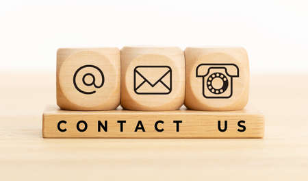 Contact us concept. Wooden blocks with email, mail and telephone icons.Website page contact us or e-mail marketingの写真素材