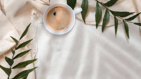 closeup black coffee cup put on linen fabric. top viewの写真素材