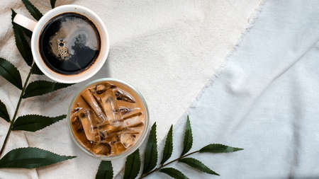 closeup black coffee cup put on linen fabric. top viewの写真素材
