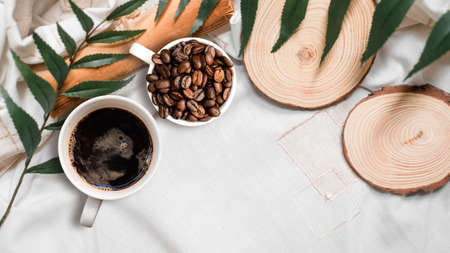 closeup black coffee cup put on linen fabric. top viewの写真素材