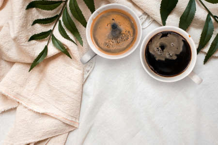 closeup black coffee cup put on linen fabric. top viewの写真素材