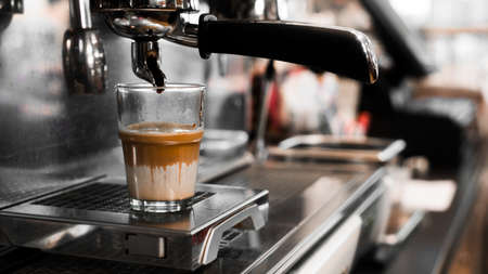black coffee with milk on coffee maker