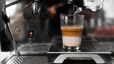 black coffee with milk on coffee makerの写真素材