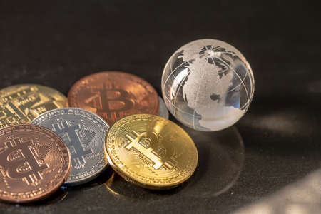 Glass globe and Bitcoin Cryptocurrency. Business concept
