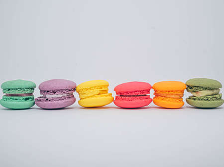 pastel colored macarons isolated on white background.の写真素材