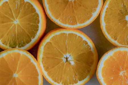 Orange slice . Background of half cut oranges on orange background