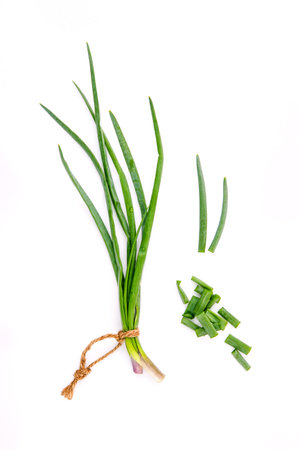 Branch of fresh spring onions and spring onions chops for seasoning concept isolated on white...