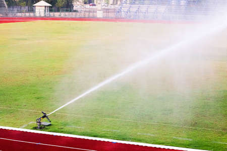 Watering the football fieldの写真素材