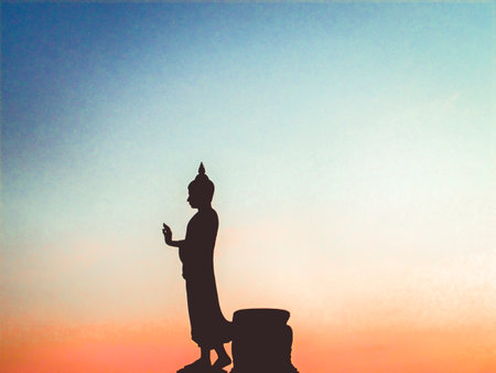 Big Buddha statue silhouette vanila sky blue pink orange shade at sunset beautiful backgroundの写真素材