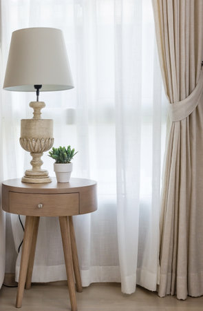 white classic lamp on table side in bedroom with at homeの写真素材