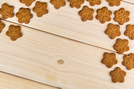 Ð¡hristmas homemade gingerbread cookies on wooden background with empty copy space for your text.