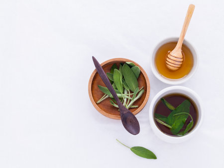The cup of sage healthy drinking tea for warm when illness and cold.の写真素材