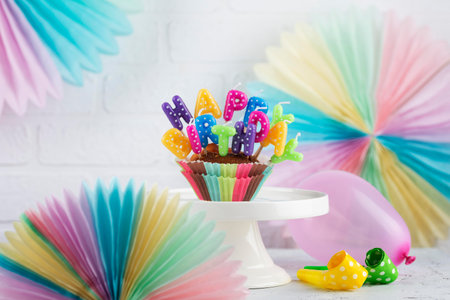 Birthday party cupcakes with candlesの写真素材