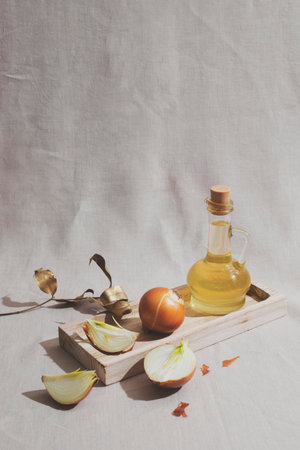 Onions on wooden board high angleの写真素材