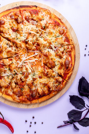Pizza topped with extra cheese basilの写真素材